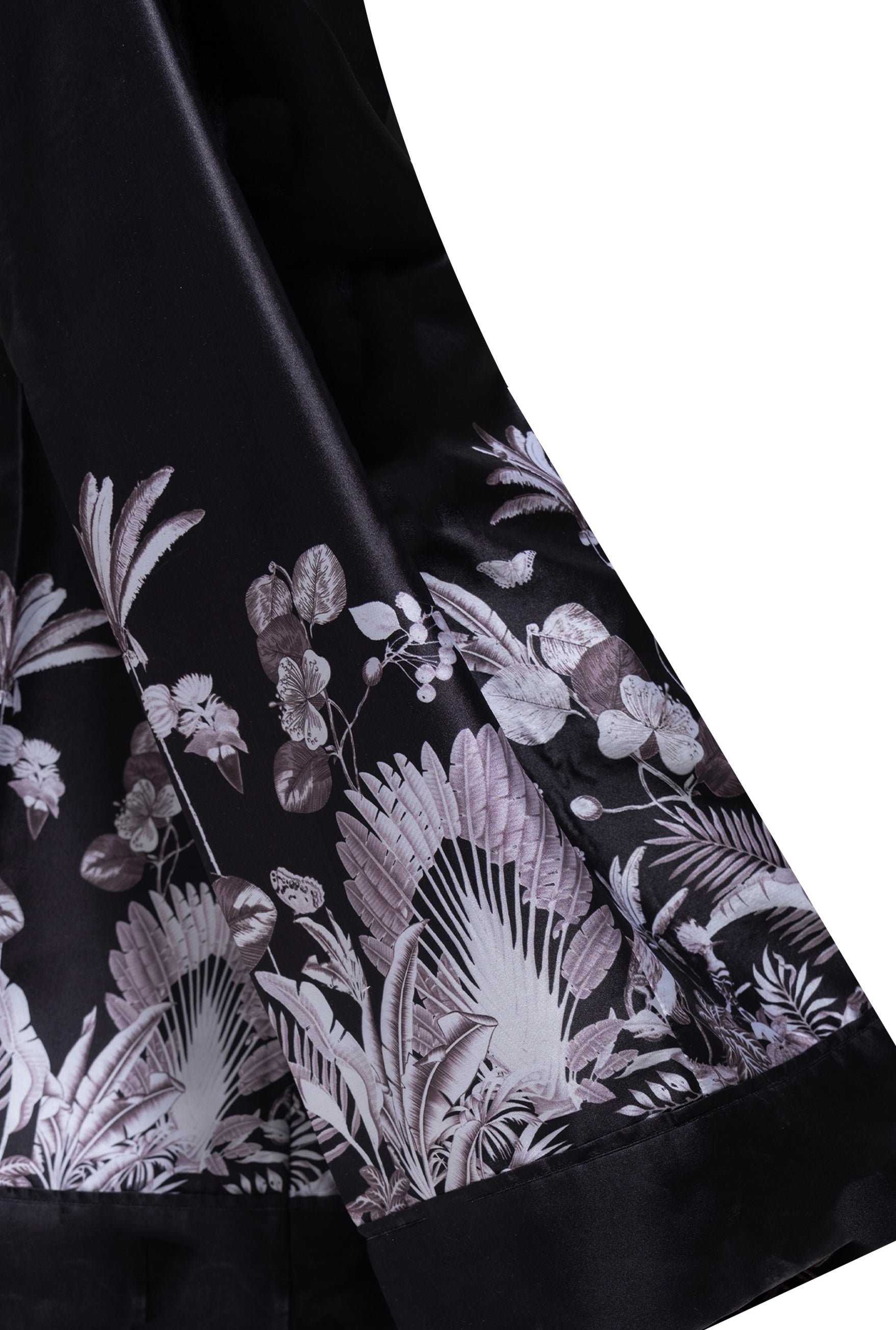 A close-up of the Boss Lady Silk Blazer, highlighting its soft, silky fabric and structured silhouette. The blazer features a single-button closure, sharp lapels, and subtle stitching details, adding a refined touch to the sophisticated design.