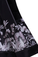 A close-up of the Boss Lady Silk Blazer, highlighting its soft, silky fabric and structured silhouette. The blazer features a single-button closure, sharp lapels, and subtle stitching details, adding a refined touch to the sophisticated design.