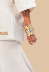 Close-up view of the soft, cozy fleece fabric of the cream oversized uni t-shirt.