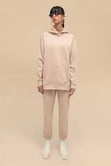 front view of the Neutral Nude Uni Hoodie Set, highlighting the casual yet stylish design of the hoodie and jogger pants.
