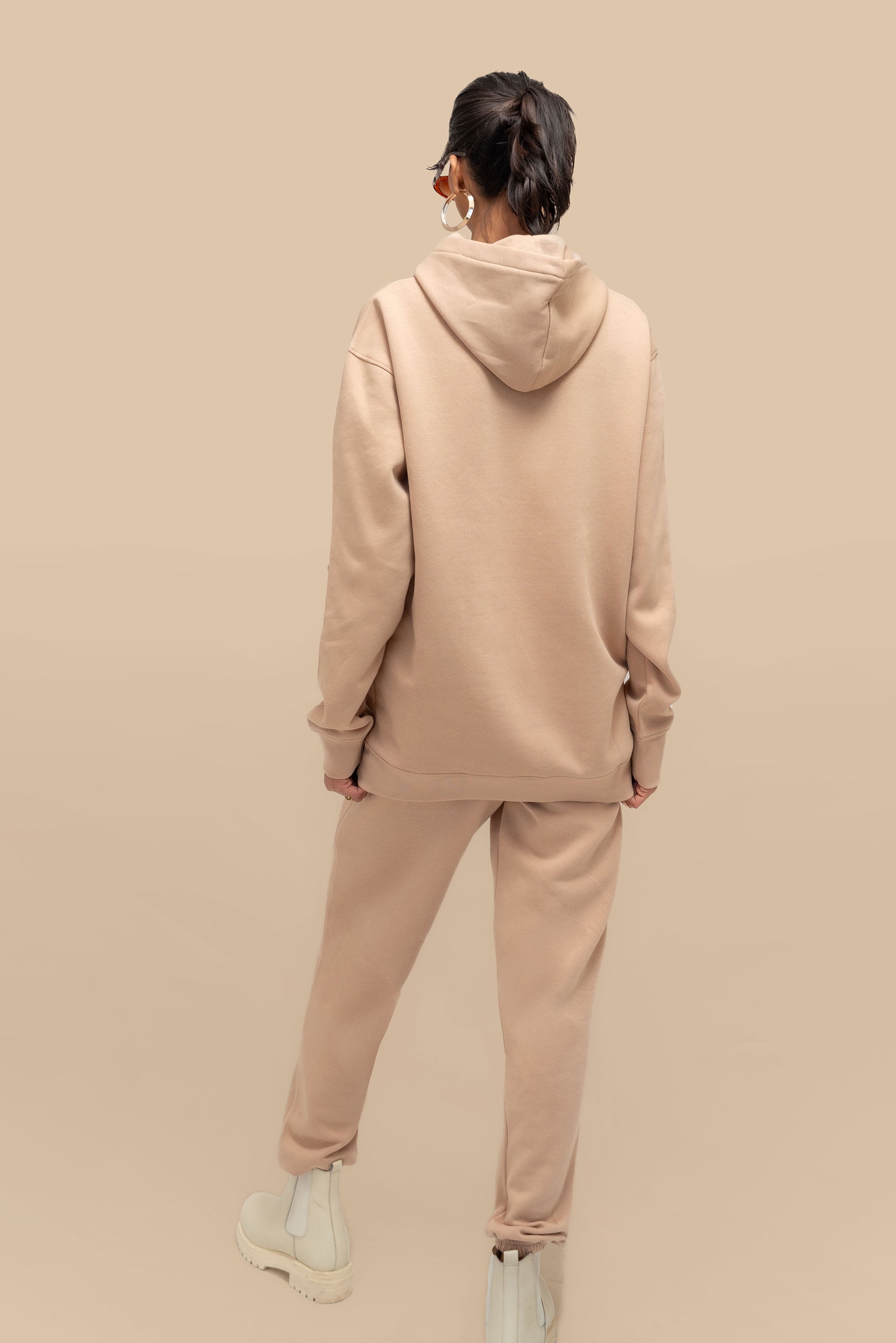 Back view of the Neutral Nude Uni Hoodie Set, showcasing the cozy hoodie with a relaxed fit and matching joggers.