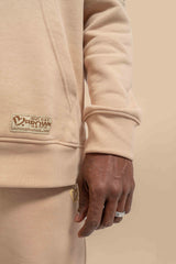 Close-up of the Neutral Nude Uni Hoodie, showing the soft fabric texture and comfortable, casual design.