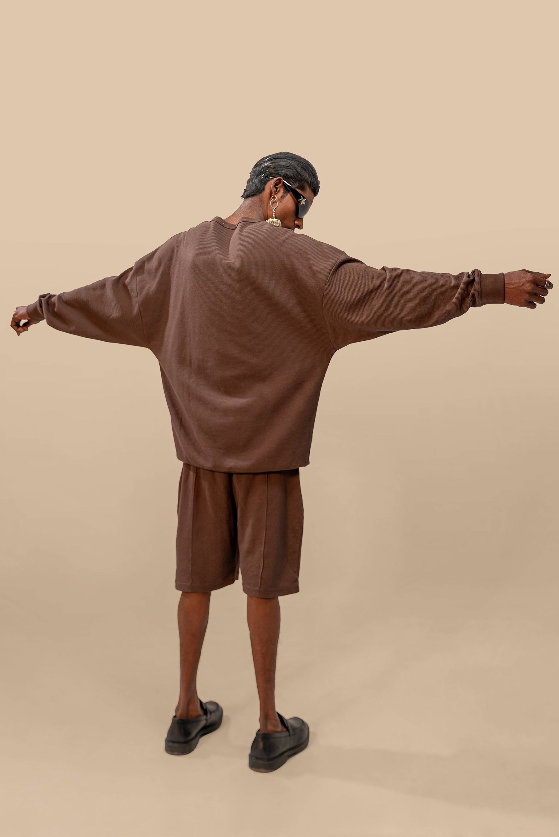 Back view of the Toffee Brown Uni thermal short set, emphasizing the smooth finish of the thermal top and the comfy fit of the shorts.