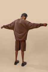 Back view of the Toffee Brown Uni thermal short set, emphasizing the smooth finish of the thermal top and the comfy fit of the shorts.