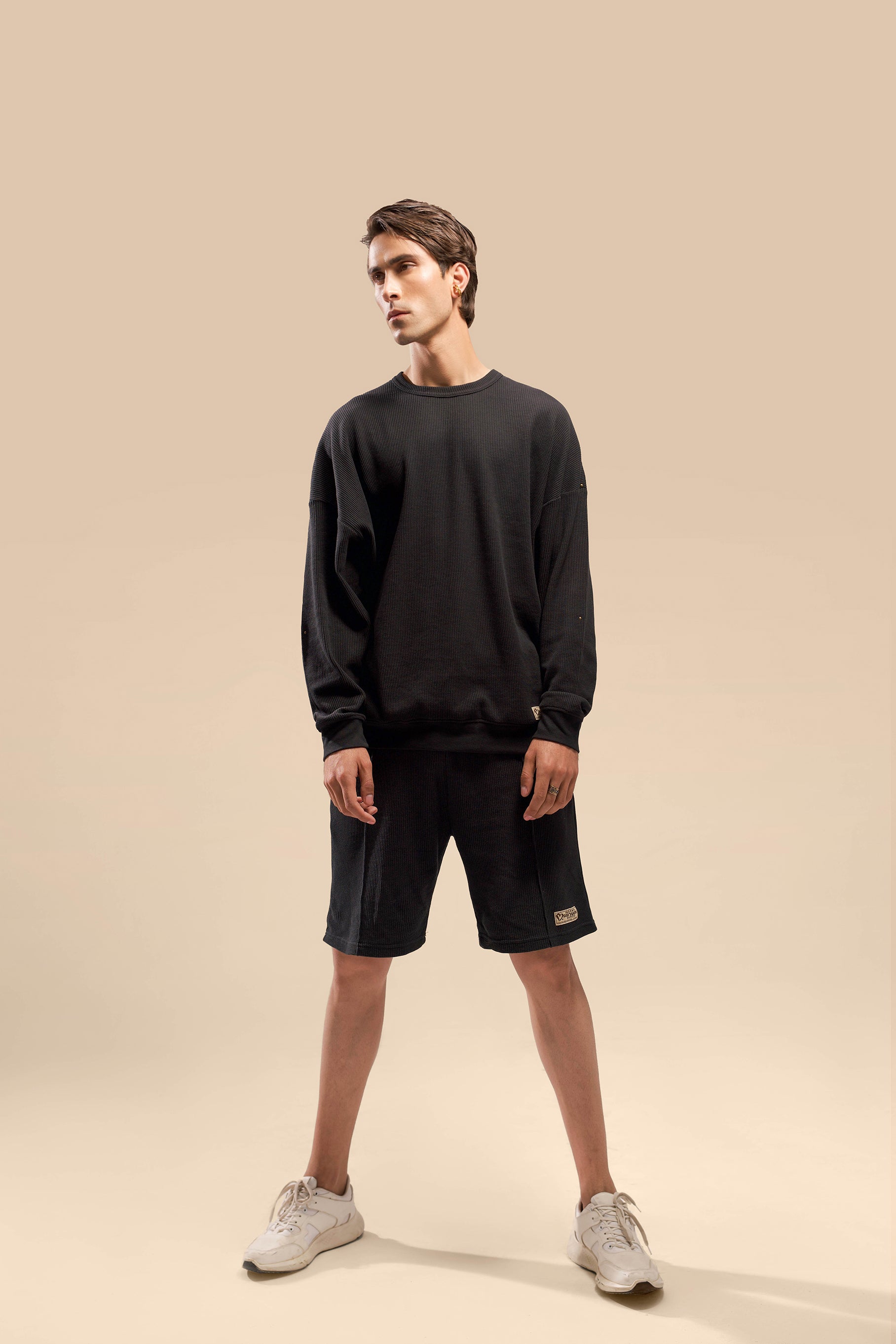  front view of the Urban Black Uni thermal short set, highlighting the cozy thermal fabric and relaxed fit.