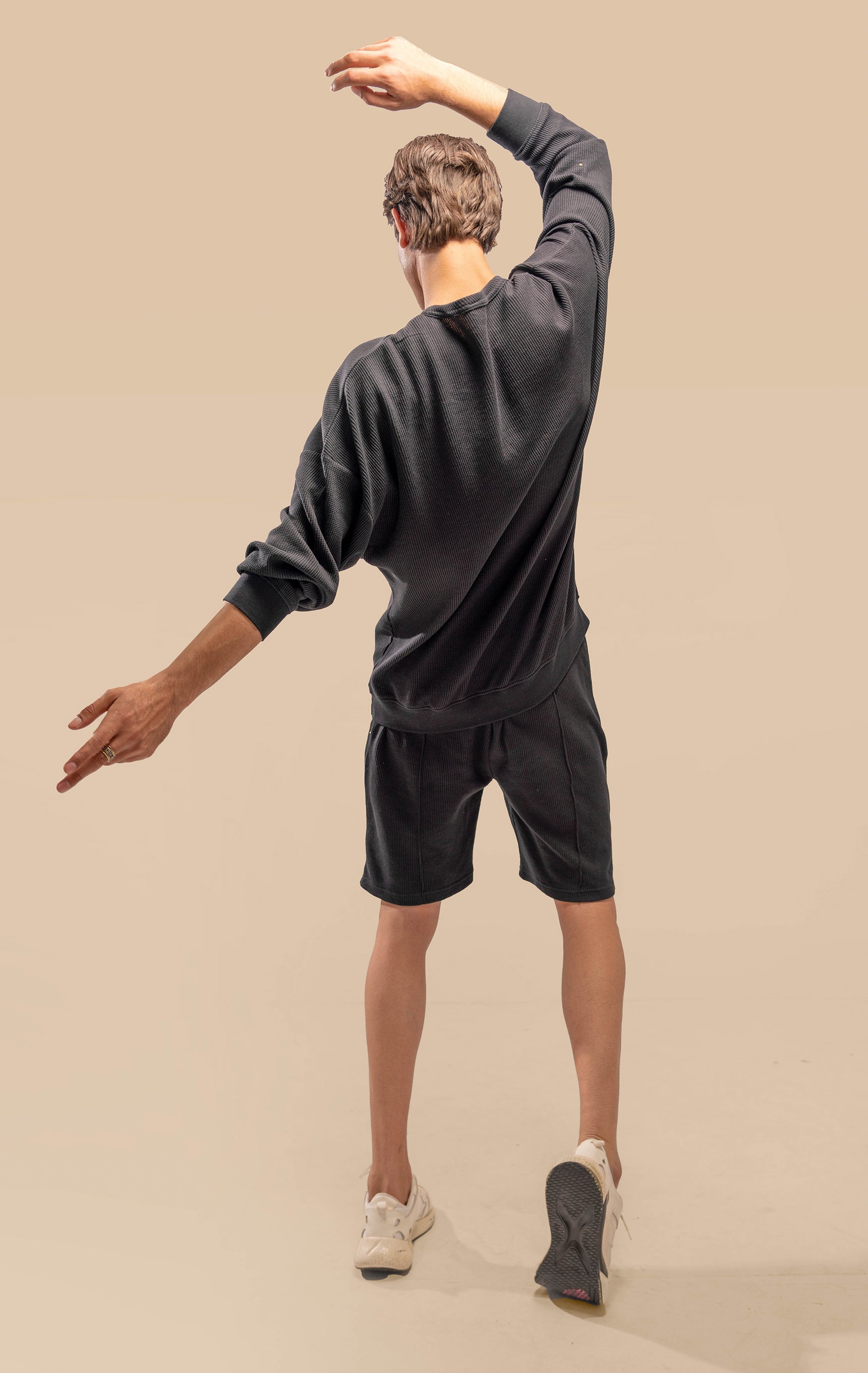 Back view of the Urban Black Uni thermal short set, showing the simple yet stylish design of the thermal top and shorts.