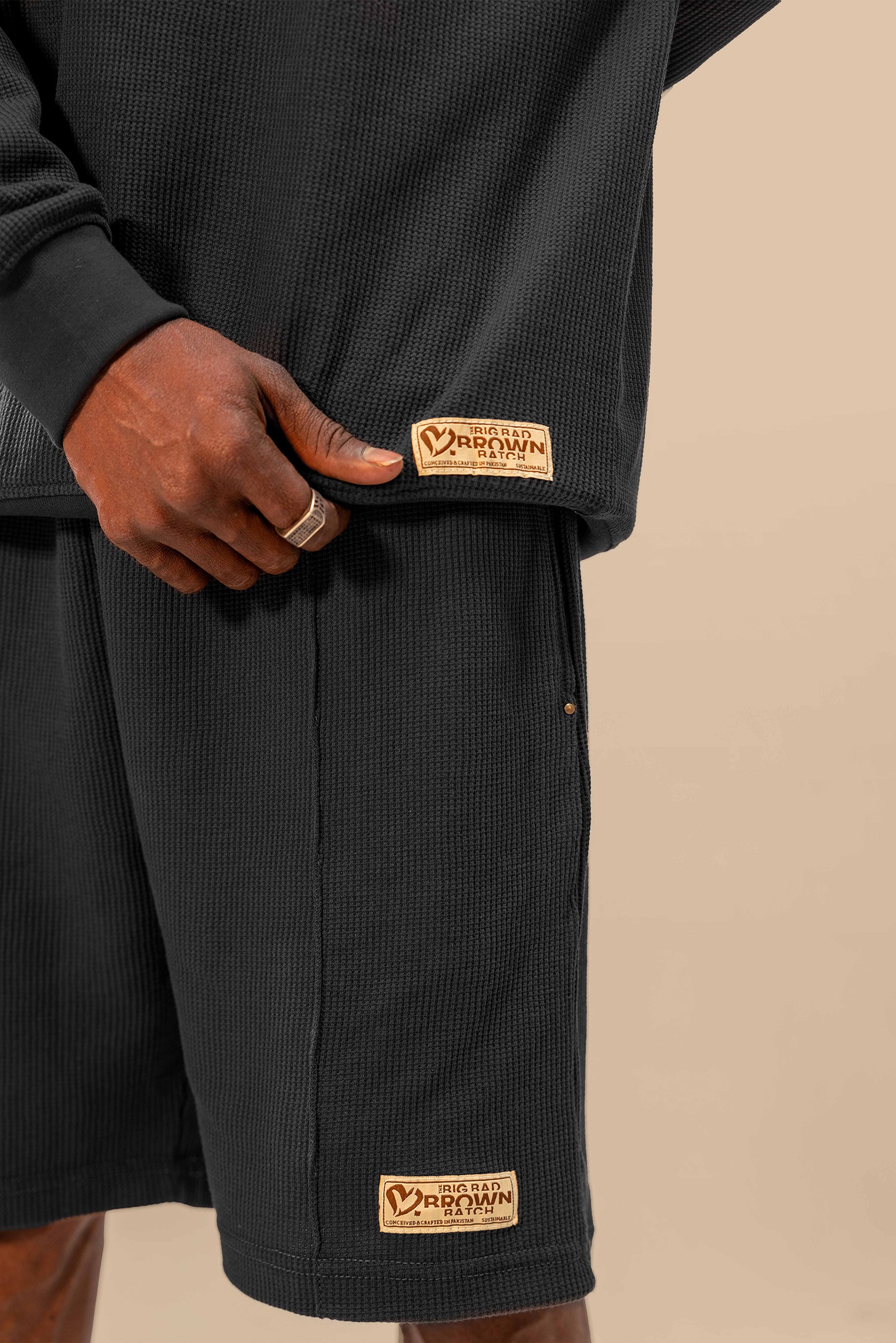 Close-up of the black thermal top from the Urban Black Uni thermal short set, showcasing the texture and comfortable fit of the fabric.