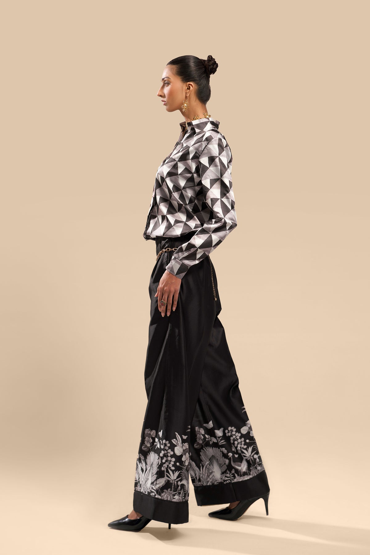 A full view of the Boss Lady Silk Co-Ord Set featuring a sleek, tailored blazer paired with matching high-waisted trousers. The outfit is in a luxurious deep satin finish, exuding elegance with its rich color and contemporary design. The blazer is buttoned with sharp lapels, and the trousers have a relaxed fit that tapers at the ankle.